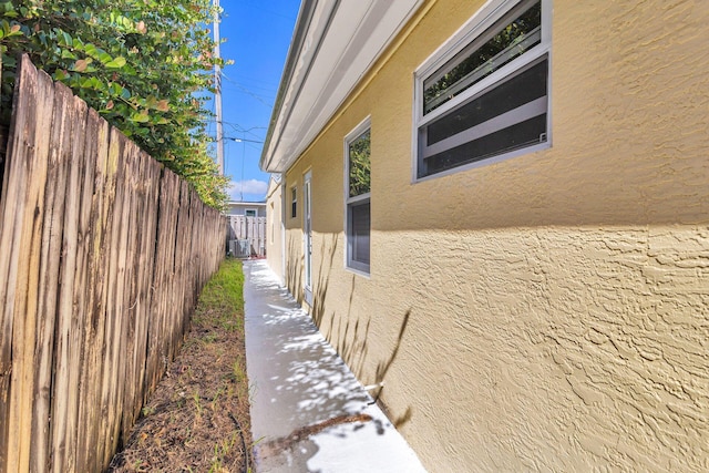 view of side of property with central AC