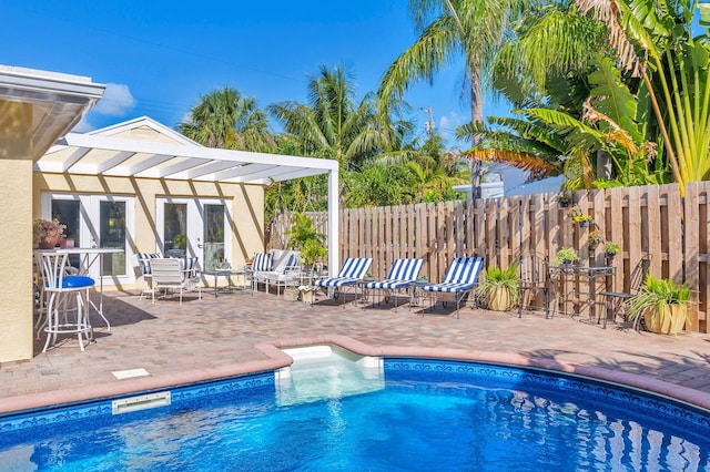 view of pool with a pergola and a patio area