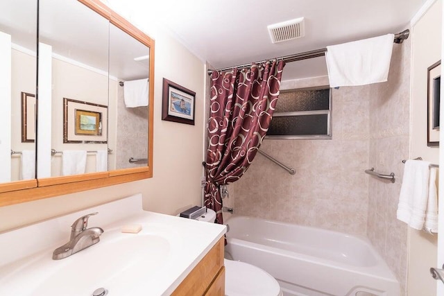 full bathroom featuring vanity, toilet, and shower / tub combo