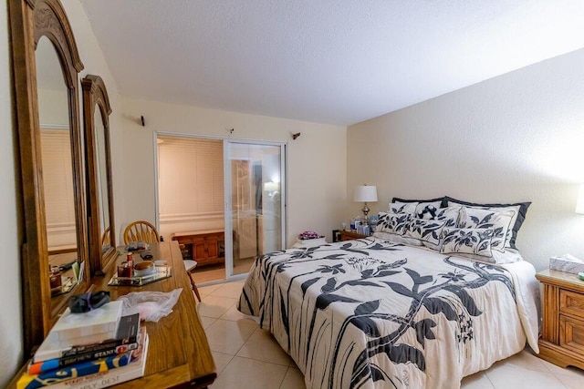 tiled bedroom featuring connected bathroom