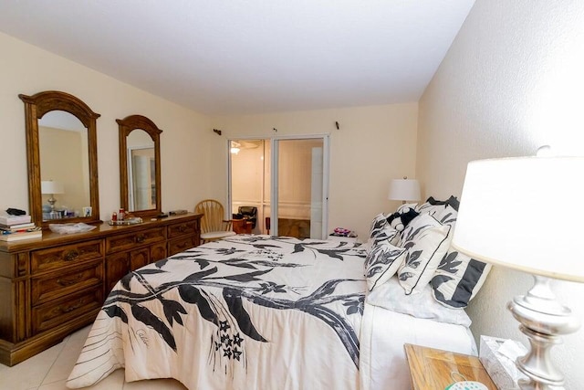 bedroom featuring a closet and light tile patterned flooring