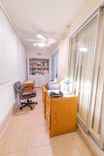 corridor featuring light tile patterned floors