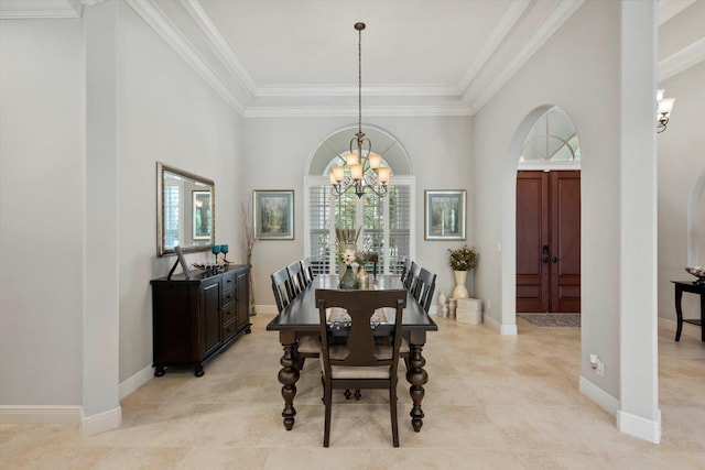 dining area featuring a chandelier, baseboards, and a healthy amount of sunlight