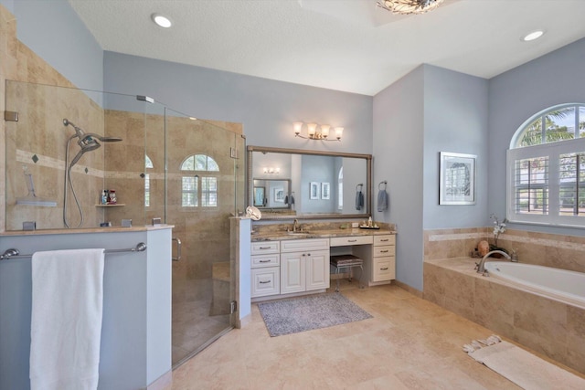 full bathroom with a bath, tile patterned flooring, a shower stall, and vanity