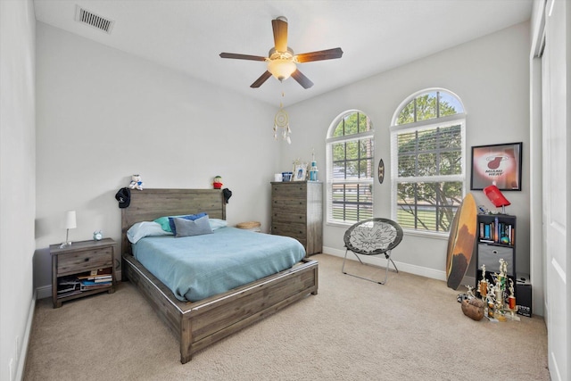 bedroom with light carpet, baseboards, visible vents, and ceiling fan