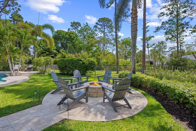 view of patio / terrace featuring fence and a fire pit