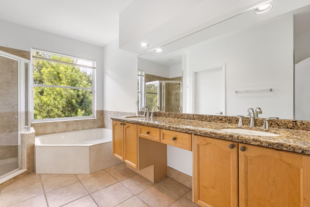 bathroom featuring tile patterned flooring, vanity, and independent shower and bath