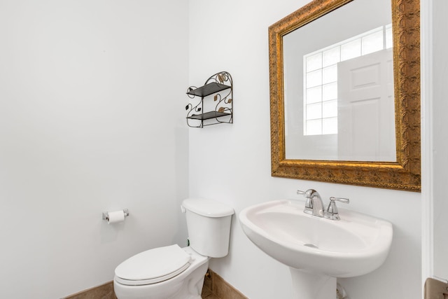 bathroom featuring sink and toilet