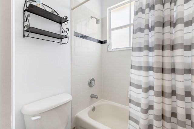 bathroom featuring toilet and shower / tub combo with curtain