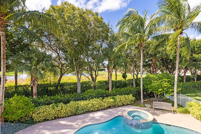 view of pool featuring an in ground hot tub and a patio area