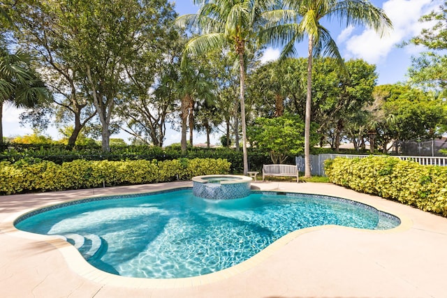 view of pool with an in ground hot tub and a patio area