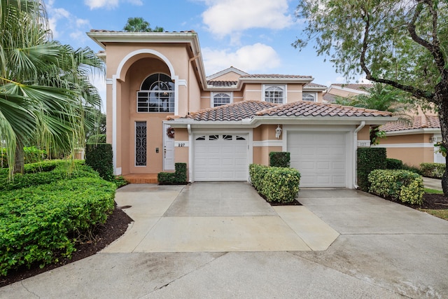 mediterranean / spanish house featuring a garage