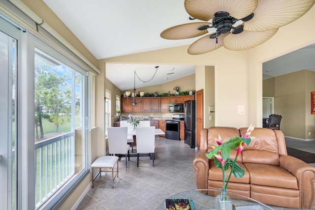 227 Legendary Cir, Palm Beach Gardens, FL 33418 - sunroom featuring vaulted ceiling and a chandelier