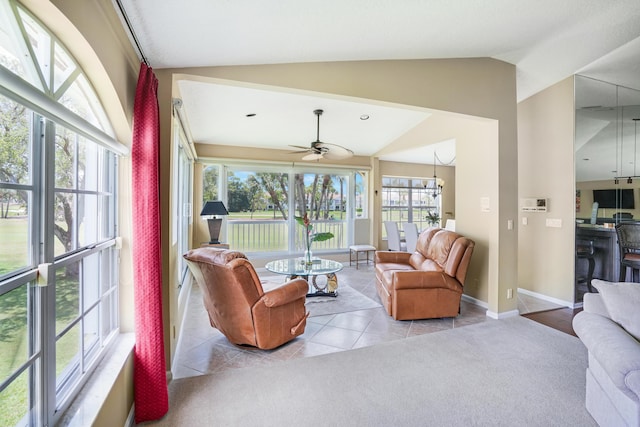 227 Legendary Cir, Palm Beach Gardens, FL 33418 - carpeted living room featuring lofted ceiling, tile patterned flooring, ceiling fan, and baseboards