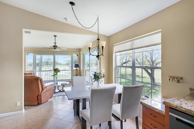 227 Legendary Cir, Palm Beach Gardens, FL 33418 - dining space with vaulted ceiling, plenty of natural light, light tile patterned floors, ceiling fan, and baseboards