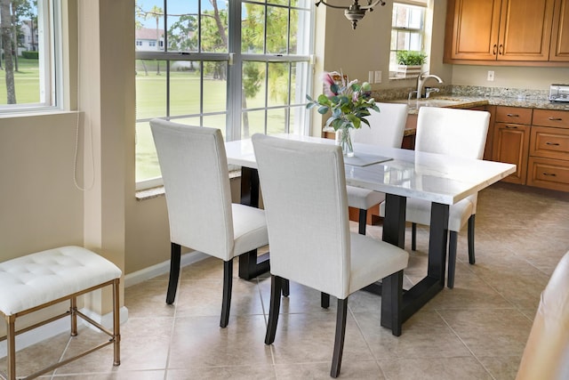 227 Legendary Cir, Palm Beach Gardens, FL 33418 - dining room with light tile patterned floors and a chandelier