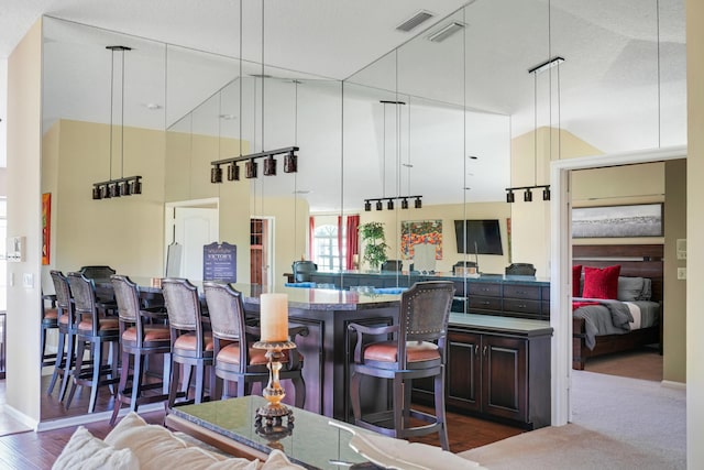 227 Legendary Cir, Palm Beach Gardens, FL 33418 - bar area featuring a high ceiling and dark wood-style flooring