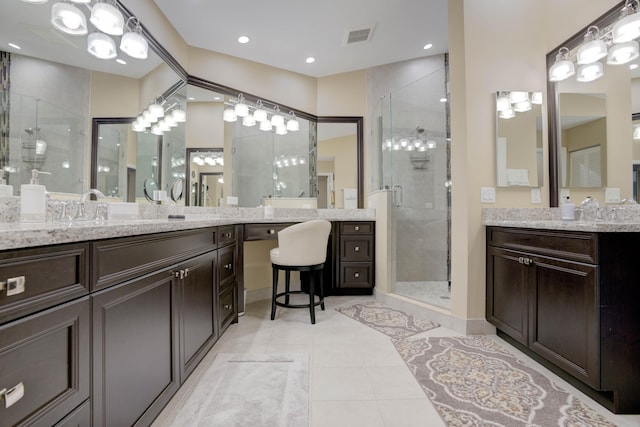 227 Legendary Cir, Palm Beach Gardens, FL 33418 - bathroom featuring a shower stall, tile patterned floors, and vanity