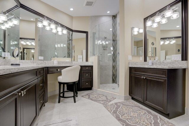 227 Legendary Cir, Palm Beach Gardens, FL 33418 - bathroom featuring a shower stall, tile patterned flooring, and vanity
