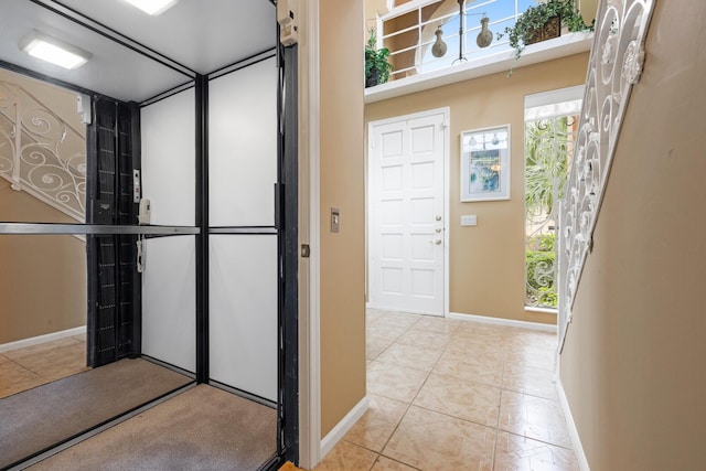 227 Legendary Cir, Palm Beach Gardens, FL 33418 - bathroom featuring baseboards, elevator, and tile patterned flooring