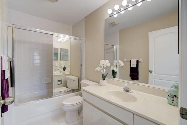 full bathroom featuring vanity, combined bath / shower with glass door, and toilet