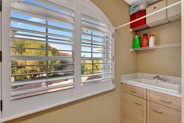 227 Legendary Cir, Palm Beach Gardens, FL 33418 - clothes washing area with a sink