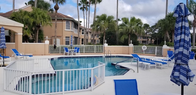 227 Legendary Cir, Palm Beach Gardens, FL 33418 - community pool with fence and a patio