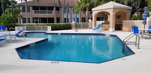 227 Legendary Cir, Palm Beach Gardens, FL 33418 - community pool with a patio area and fence