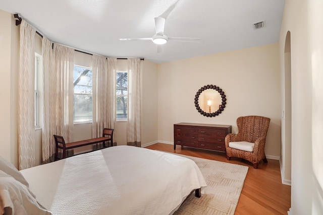 bedroom with hardwood / wood-style flooring and ceiling fan