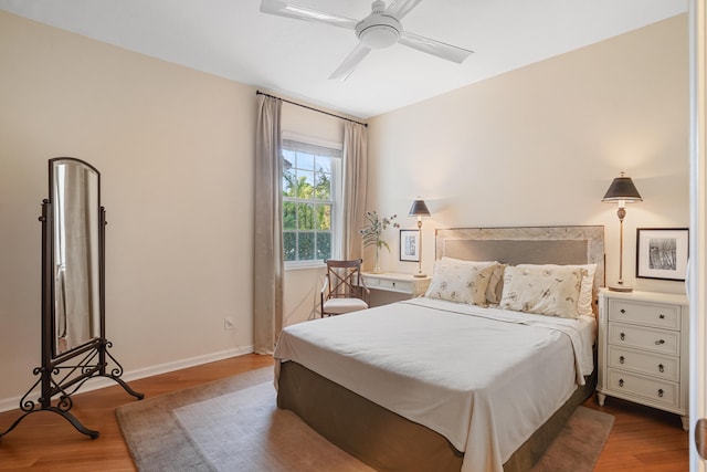 bedroom featuring hardwood / wood-style floors and ceiling fan