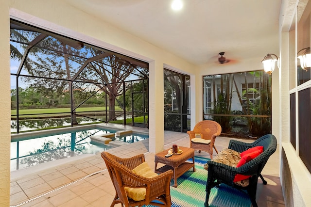 sunroom / solarium with a wealth of natural light, a swimming pool with hot tub, and a water view