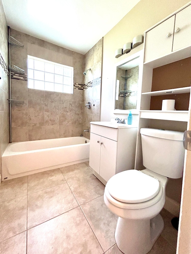 full bathroom with tile patterned flooring, vanity, toilet, and tiled shower / bath