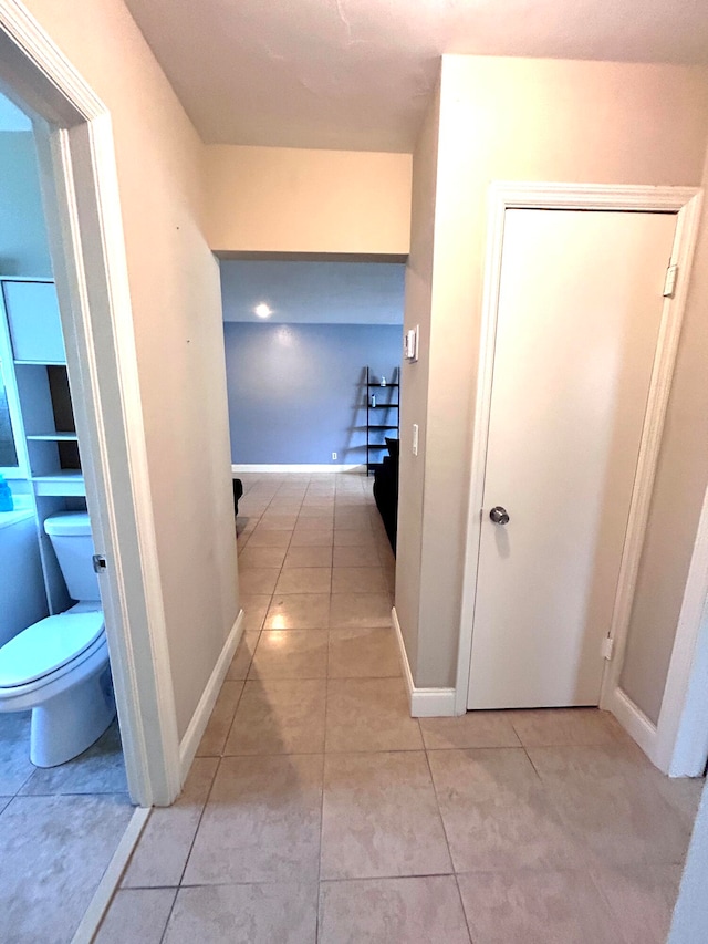 hallway with light tile patterned floors