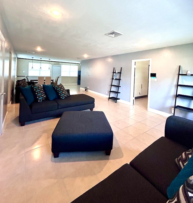 living room with light tile patterned flooring