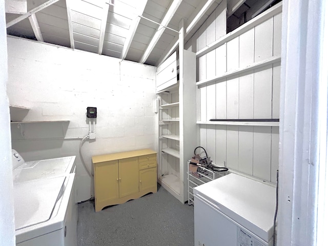 clothes washing area featuring washer and clothes dryer