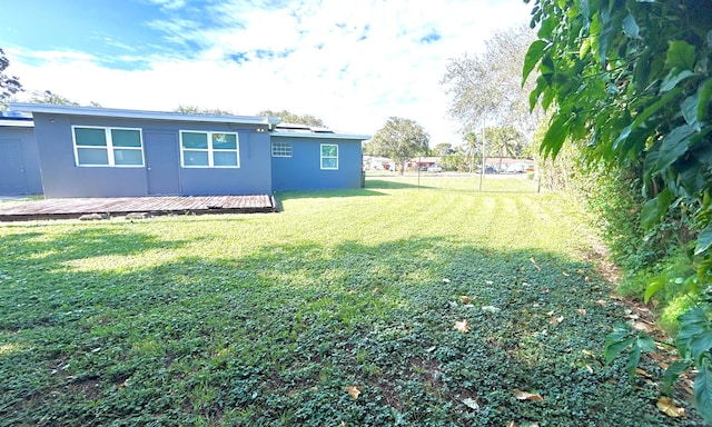 view of yard featuring a wooden deck