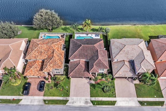 birds eye view of property featuring a water view