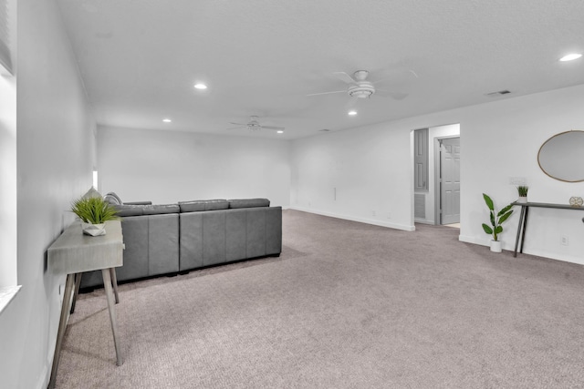 carpeted living room featuring ceiling fan