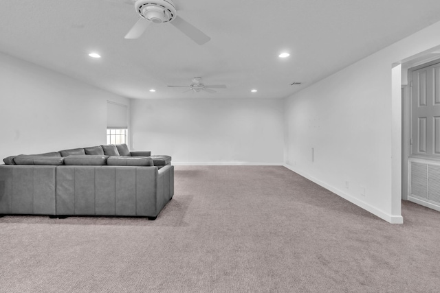 living room featuring ceiling fan and light carpet