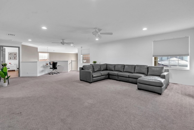 living room with light colored carpet and ceiling fan