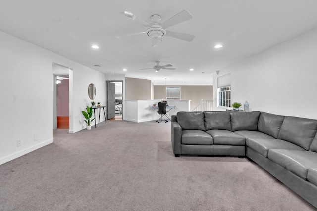 living room featuring light colored carpet and ceiling fan