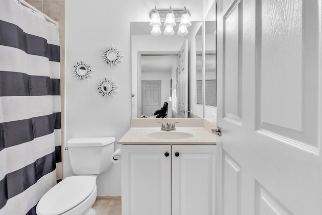 bathroom featuring vanity, a shower with curtain, and toilet