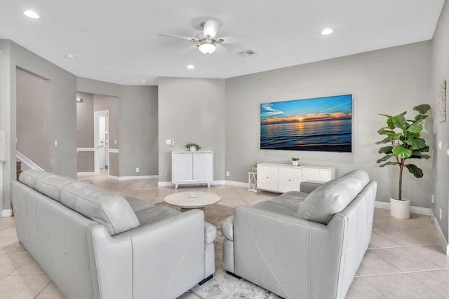 tiled living room featuring ceiling fan