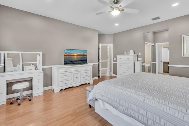 bedroom with light hardwood / wood-style floors and ceiling fan