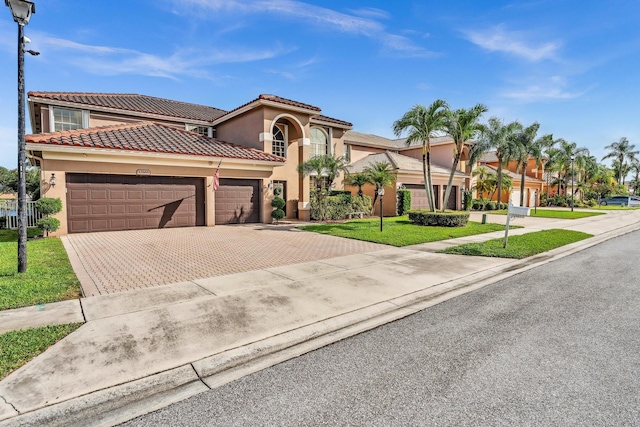 mediterranean / spanish home with a front lawn