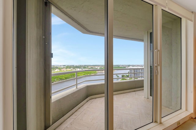 balcony featuring a water view