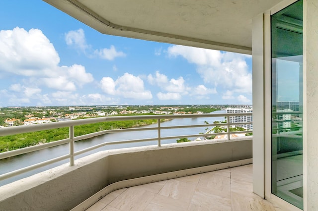 balcony featuring a water view