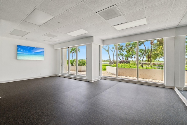 spare room featuring a paneled ceiling