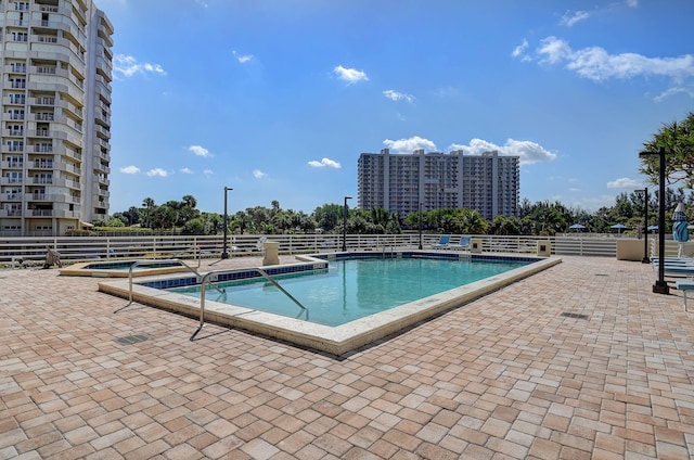 view of swimming pool with a patio area