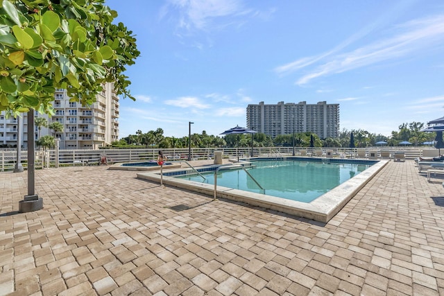 view of pool featuring a patio area